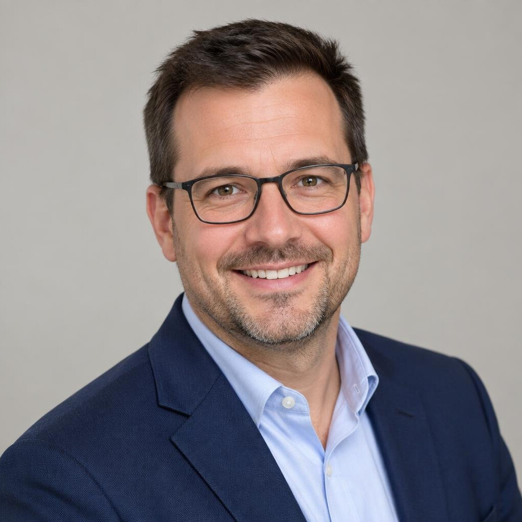 Studio portrait of a smiling Belgian businessman